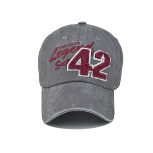 Detail of vintage washed baseball cap with 42 legend embroidery and distressed cotton fabric