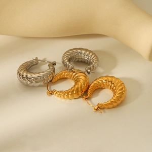 Minimalist 18K gold and silver croissant style hoop earrings in stainless steel