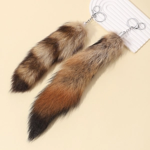 Set of two fluffy fox tail keychains with natural brown gradient fur and silver metal clips