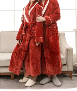 Close-up of thick pineapple plaid flannel robe showing soft texture and contrast piping