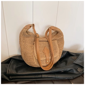 Straw crescent underarm bag with light brown leather strap and metal buckle detail