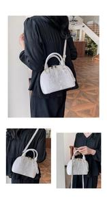 Detailed views of a white crocodile embossed shell bag with gold hardware and strap