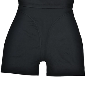 Close-up of black high-waisted shaping shorts featuring smooth elastic compression fabric