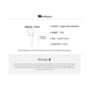 Detailed view of silver needle tassel earrings with dimensions 9.5cm and material specs