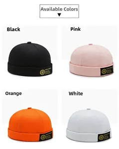 Detail view of Miki Hats in black, pink, orange and white with canvas fabric texture