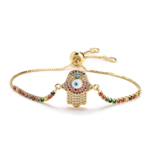 Adjustable gold Hamsa hand bracelet with colorful cubic zirconia stones and evil eye