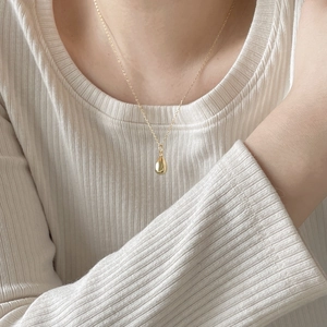 Minimalist 925 sterling silver water drop pendant necklace in gold finish on model