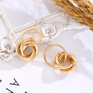 Minimalist gold multi-loop geometric earrings with a glossy metallic finish for women