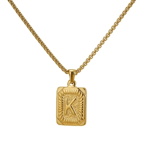Detailed shot of golden square letter K pendant on a matching box chain necklace
