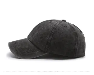 Detail view of washed denim baseball cap with ventilation eyelets and stitching