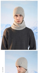 Close-up of light grey winter beanie and neck warmer set with OK logo patch