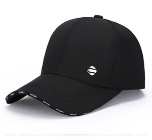 Detail of black quick-dry baseball cap with metal logo and Sport text on brim