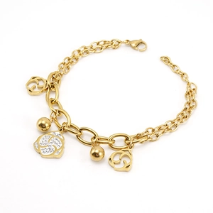 Detail of a gold double-chain bracelet featuring rose charms and sparkling white crystals