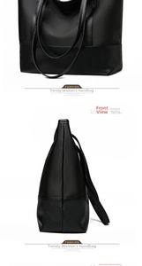 Detail view of large black Oxford cloth tote bag with reinforced leather base and side profile