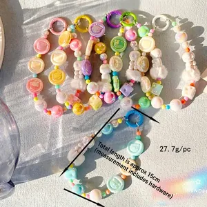 Colorful handmade beaded keychain with cartoon bear charms and soft fluffy pompons