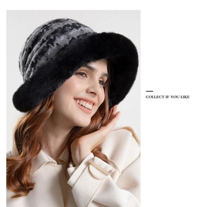 Detailed view of the winter plush bucket hat featuring black faux fur brim and knit texture