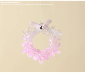 Pink gradient snowflake ornament with glitter finish, silk ribbon bow, and rhinestone detail