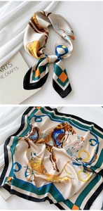 Detail showing silk satin scarf with equestrian horse carriage print in champagne and blue