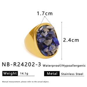 Detailed macro view of a gold stainless steel ring with colorful natural crushed stone inlay