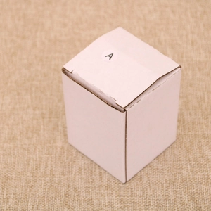 Detailed view of white corrugated cardboard gift box with a small A sticker for packaging