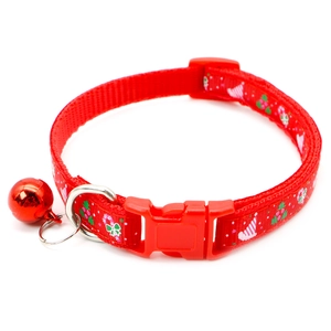 Close-up of red nylon Christmas pet collar with snowflake print and metallic bell