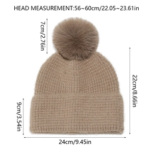 Detailed measurement showing waffle knit texture and faux fur pompom on winter beanie