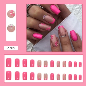 Pink daisy press-on nails with rhinestones and french tips in square shape kit