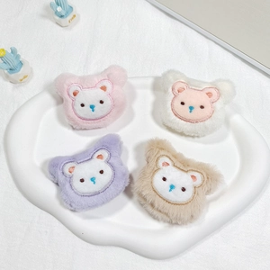 Detailed view of colorful plush bear doll accessories for DIY crafts and hair ornaments