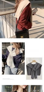 Detail of soft knitted crossover shawl in solid beige, white and dark grey colors