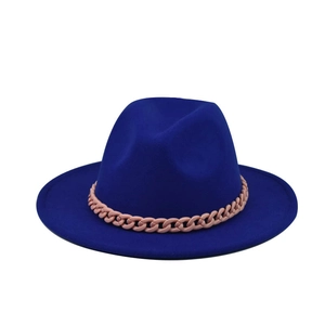 Detail of royal blue wool felt fedora featuring a light pink decorative chain band