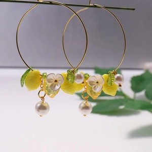 Summer lemon flower hoop earrings with yellow resin charms, pearls and green leaves