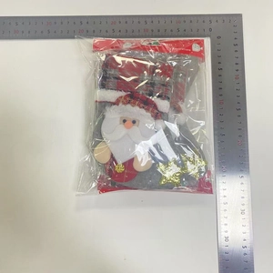 Set of 4 Christmas stockings with Santa Claus dolls and gold stars in packaging
