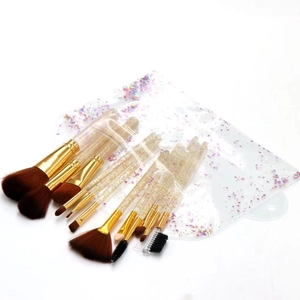 Detail of clear glitter handles on 12-piece makeup brush set with matching PVC storage bag