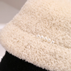Thick lamb wool bucket hat with bicolor design and pearl accents for winter warmth
