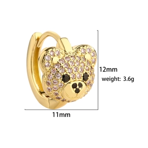 Macro detail of teddy bear huggie earrings showing 12mm size and 3.6g weight specs