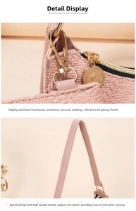 Close-up of pink woven handbag featuring high-polish gold hardware and zipper detail