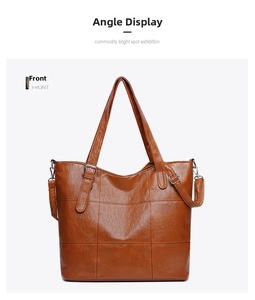 Detailed front view of brown PU leather tote bag with elegant large square stitching