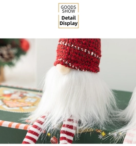 Close-up of red and white checkered knit hat and plush beard on Christmas gnome doll