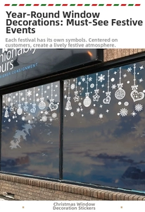 White snowflake and bell festive decals hanging decoration on a shop glass window