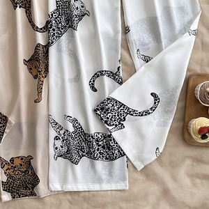 Women's ice silk lounge pants with leopard print in a loose fit and silky finish