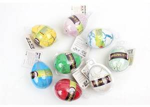 Detail of colorful growing dinosaur eggs with crack textures in transparent packaging