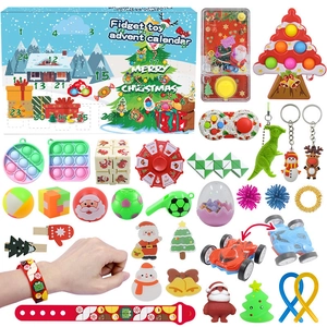 Flat lay of Christmas advent calendar with 24 fidget toys including pop its and puzzles