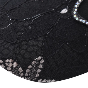 Close-up of black lace baseball cap with sparkling rhinestone detailing on the edge