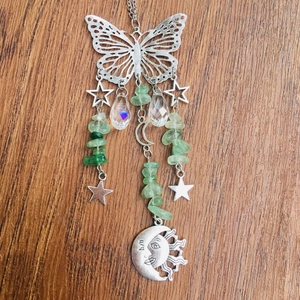 Detail of silver butterfly suncatcher with crystal beads and crescent moon pendants