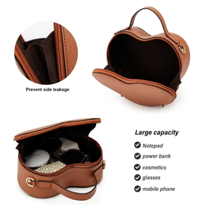 Macro detail of brown heart-shaped bag showing inner capacity and side leak-proof design