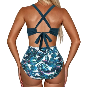 Detail of cross back straps and tropical leaf print on high-waist two-piece swimsuit
