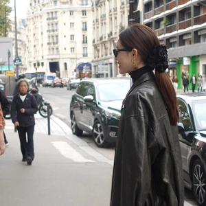 French style black lace flower hair claw clip with black leather jacket in city street