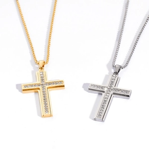Minimalist gold and silver cross necklaces with sparkling crystals on white background