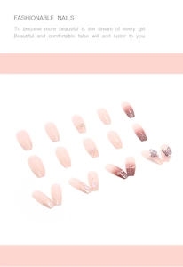 Detail of pink gradient press-on nails with 3D butterfly, pearls and silver glitter