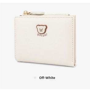 Detail of beige folding wallet with cute bear 3D emblem and gold zipper closure